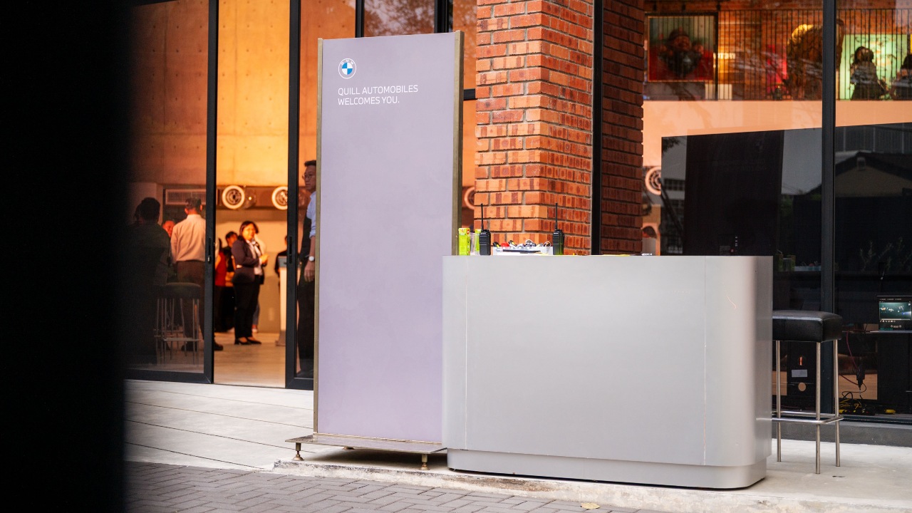 Quill Automobiles welcomes guests at the main entrance of Conservatory.