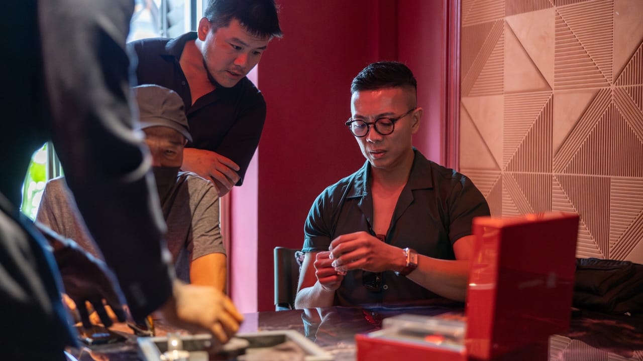 Guests examining the TAG Heuer Carrera x Porsche collection.