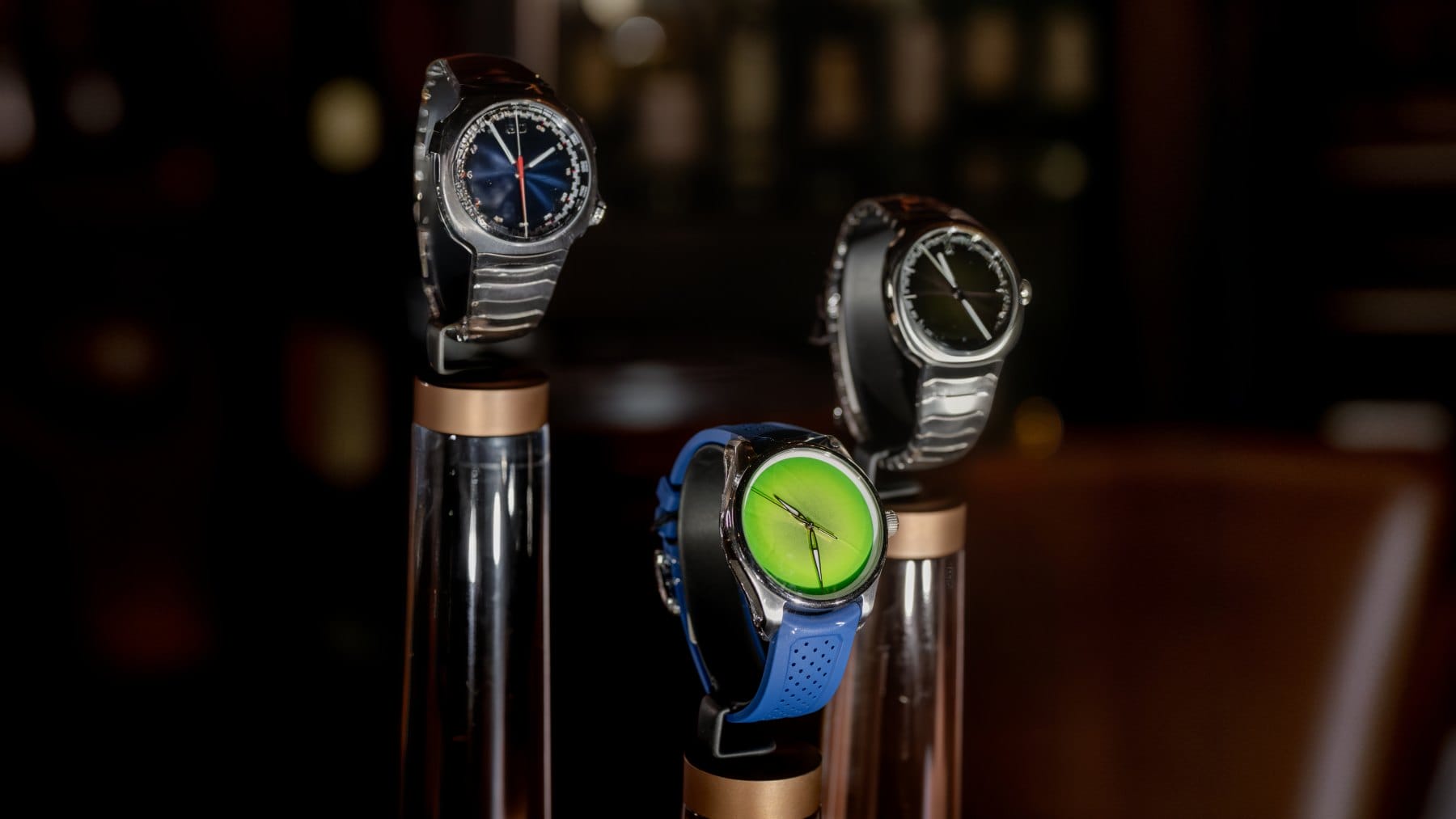 The H. Moser & Cie. Streamliner in two different shades and H. Moser & Cie. Pioneer Centre Seconds Concept Citrus Green (front).