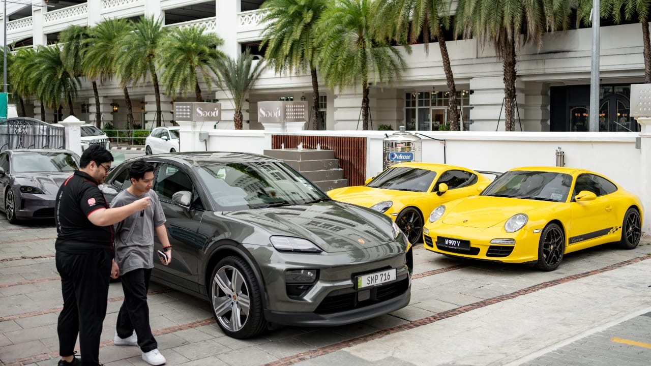 Guests experiencing the Porsche models.