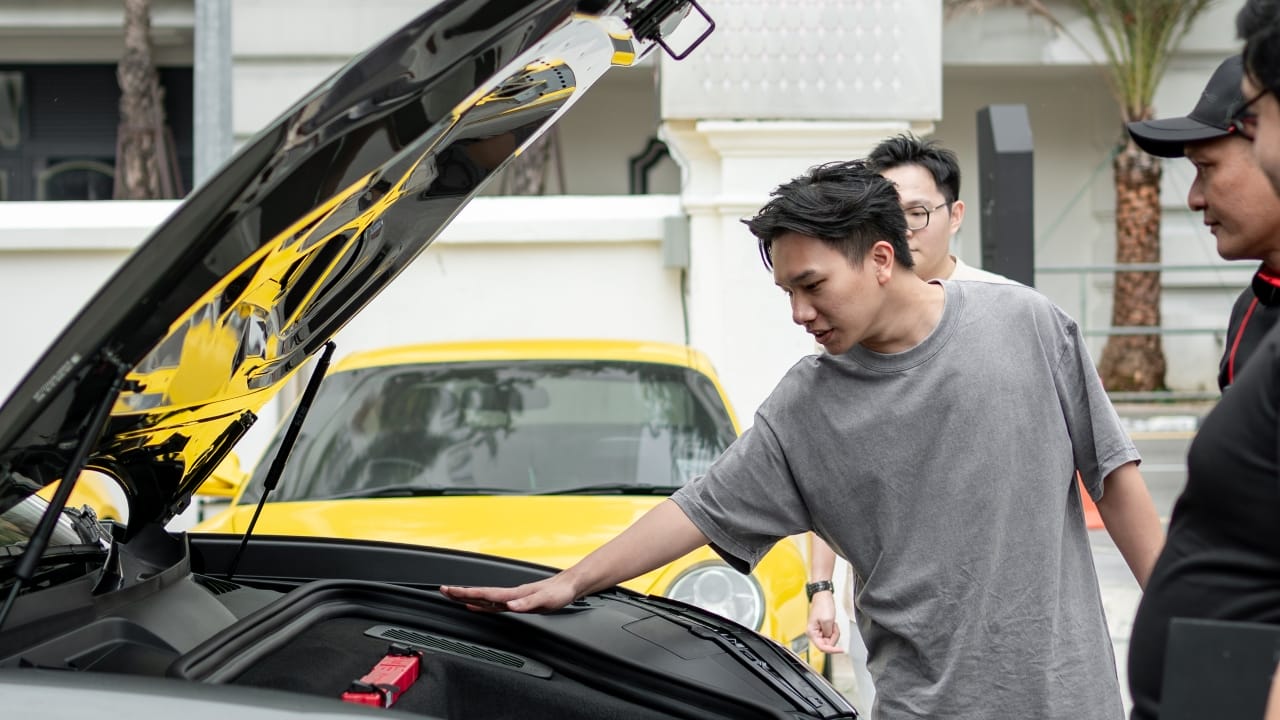 Guests experiencing the Porsche models.
